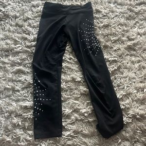 Girls Justice black rhinestone leggings.